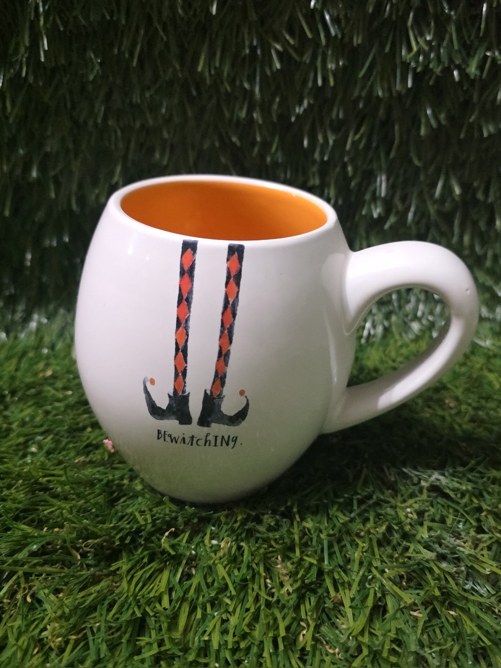 Rae Dunn White Mug with Orange Interior and Witch Leg Graphic